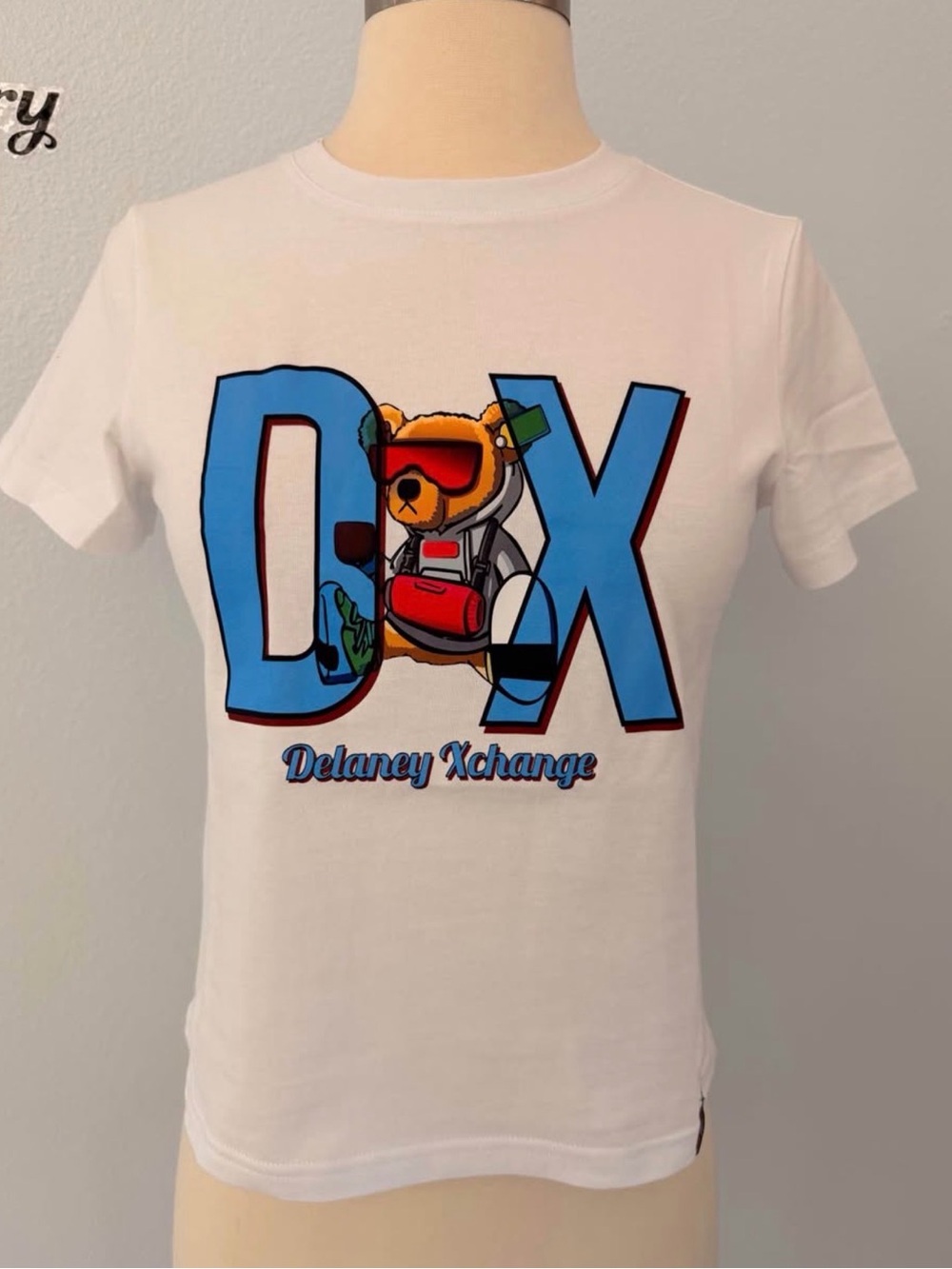 Delaney Xchange Kids White Graphic Tee with Blue DX Bear
